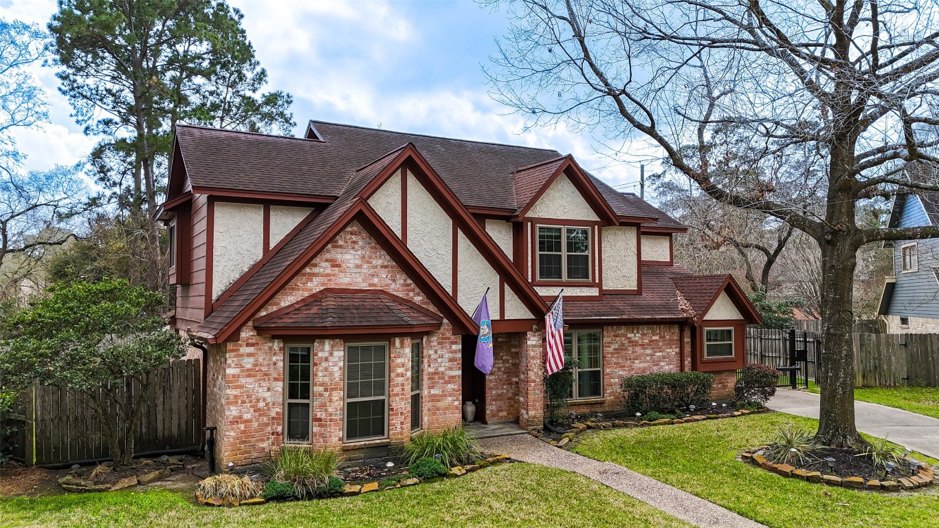 5527 Glenmere Lane Spring, TX 77379 - Photo 2 of 40 a front view of a house with garden