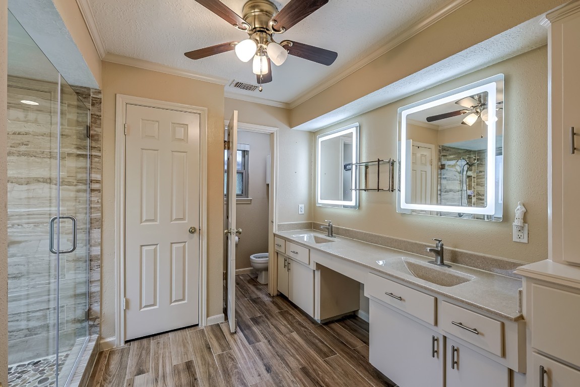 5527 Glenmere Lane Spring, TX 77379 - Photo 21 of 40 a spacious bathroom with a double vanity sink a mirror and a shower