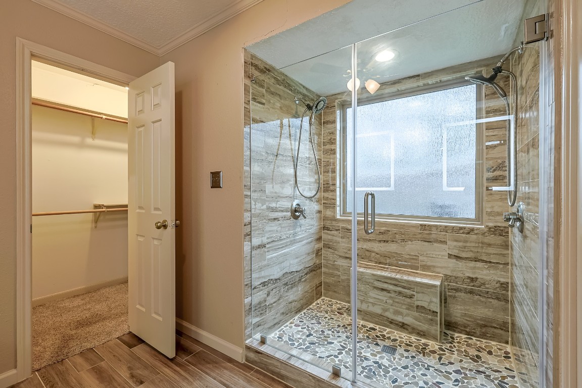 5527 Glenmere Lane Spring, TX 77379 - Photo 23 of 40 a bathroom with a glass door shower