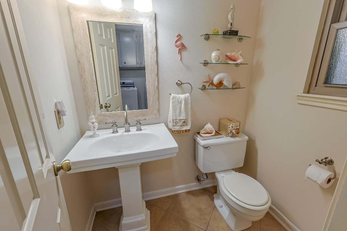 5527 Glenmere Lane Spring, TX 77379 - Photo 25 of 40 a bathroom with a sink toilet and mirror