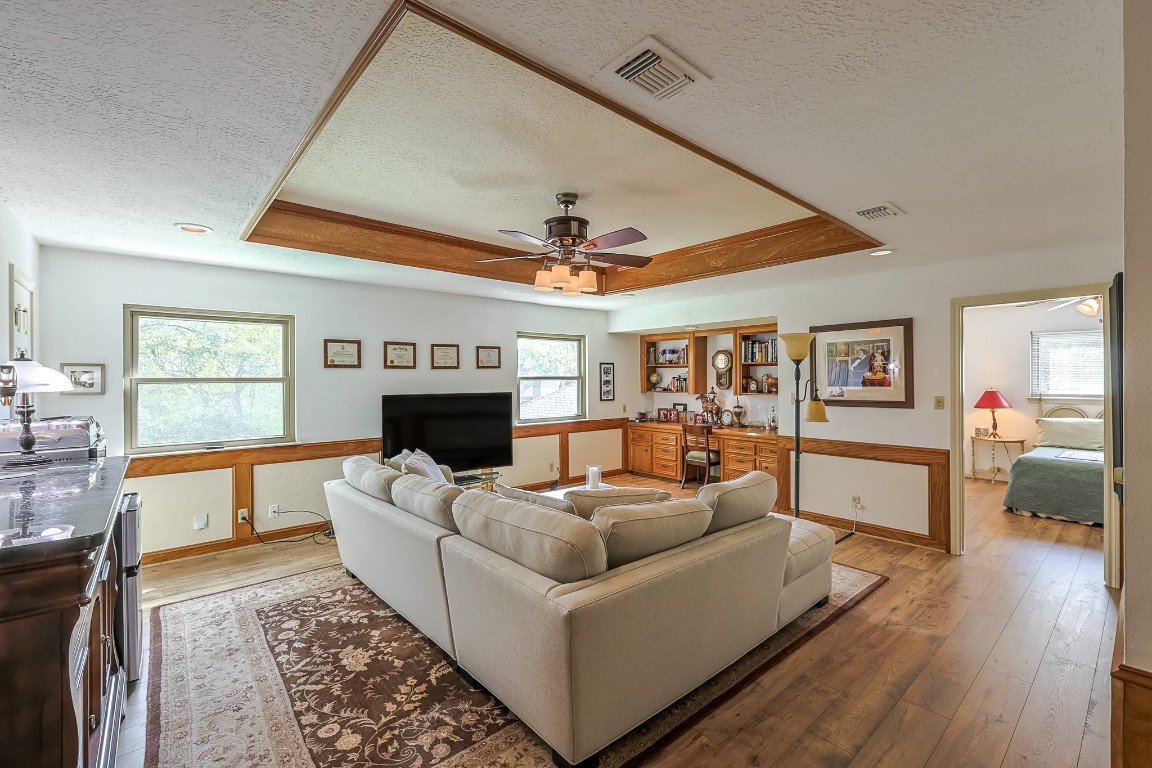 5527 Glenmere Lane Spring, TX 77379 - Photo 27 of 40 a living room with furniture and a fireplace