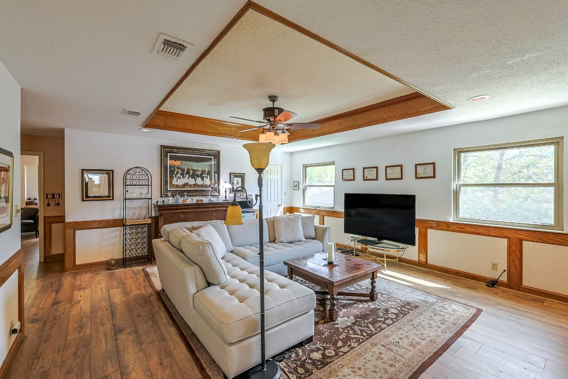 5527 Glenmere Lane Spring, TX 77379 - Photo 28 of 40 a living room with furniture and a fireplace