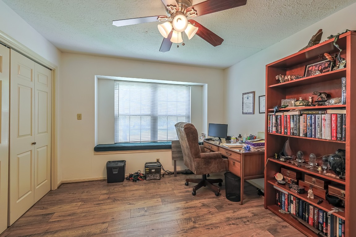 5527 Glenmere Lane Spring, TX 77379 - Photo 31 of 40 a workspace with furniture bookshelf and a window