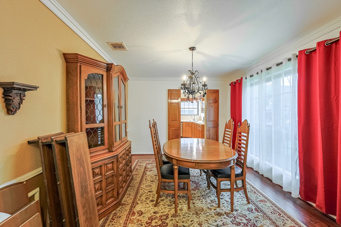 5527 Glenmere Lane Spring, TX 77379 - Photo 4 of 40 a view of a dining room with furniture and chandelier