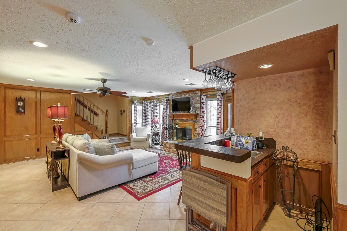 5527 Glenmere Lane Spring, TX 77379 - Photo 8 of 40 a living room with furniture and a flat screen tv