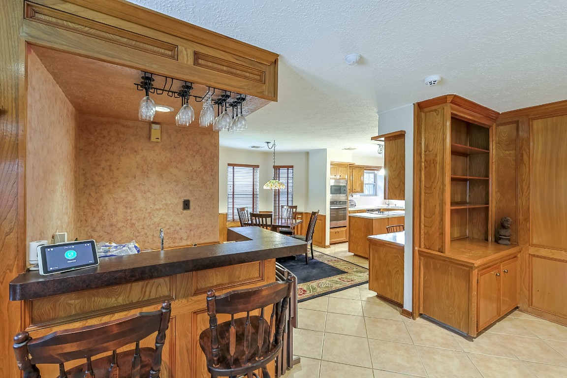 5527 Glenmere Lane Spring, TX 77379 - Photo 10 of 40 a kitchen with a sink refrigerator and cabinets