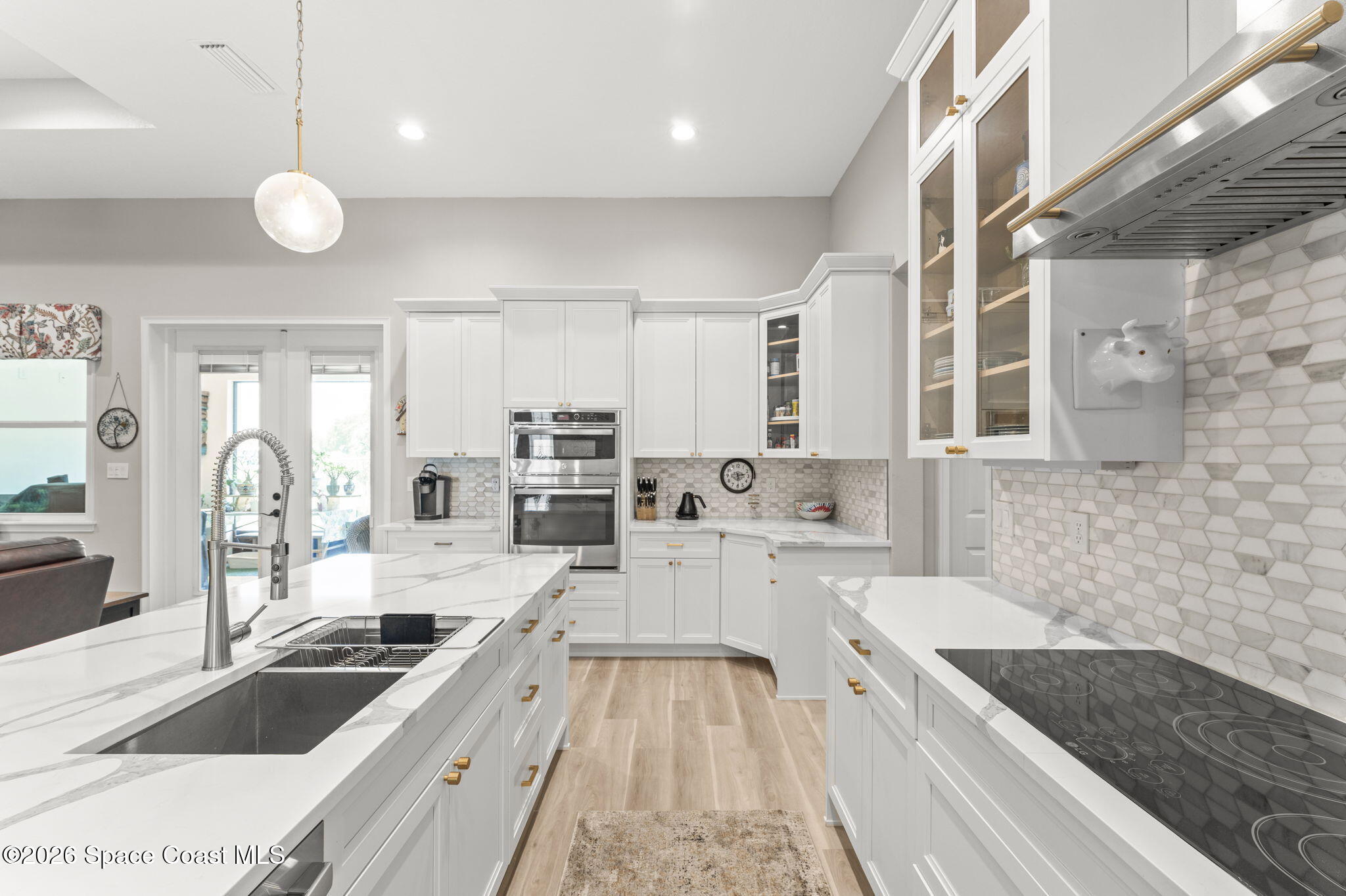 1740 Ford Road Mims, FL 32754 - Photo 15 of 43 a large kitchen with granite countertop a stove and cabinets