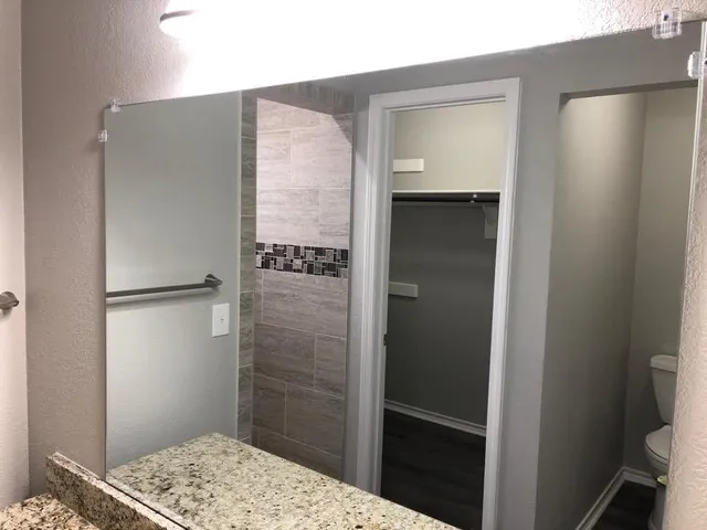 a bathroom with a shower and a sink