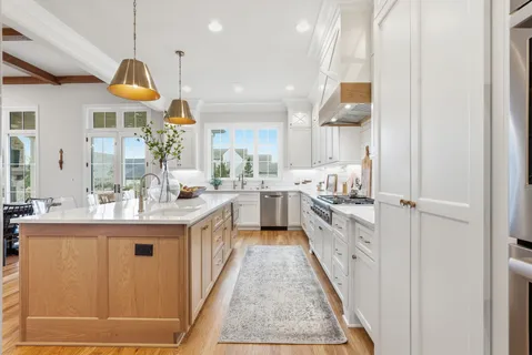 a large kitchen with stainless steel appliances granite countertop lots of counter top space