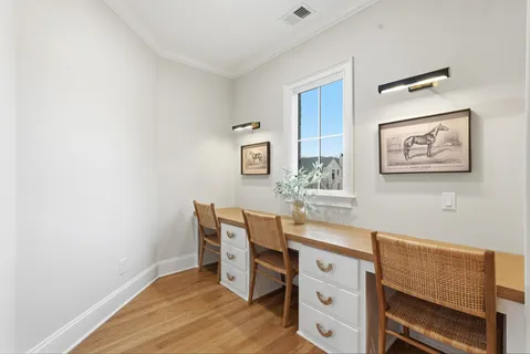 a spacious bedroom with a bed and a window