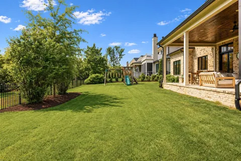an aerial view of a house with outdoor space
