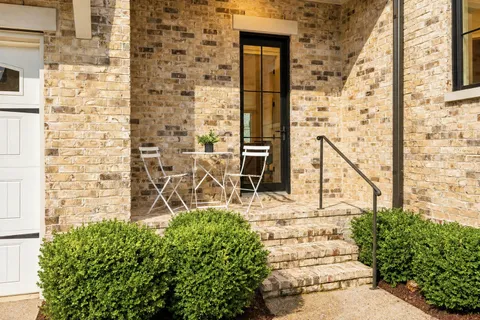 a view of front door of house with an outdoor space