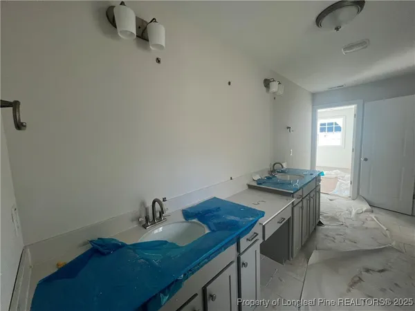 a view of hallway with wooden floor and closet