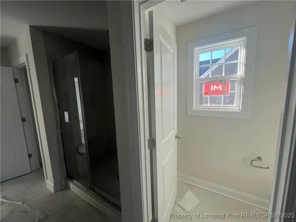 a room with a bed and a window