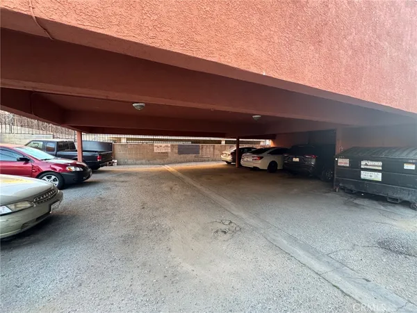 a view of parking with cars parked