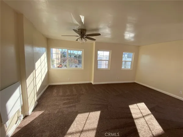 a view of an empty room and window