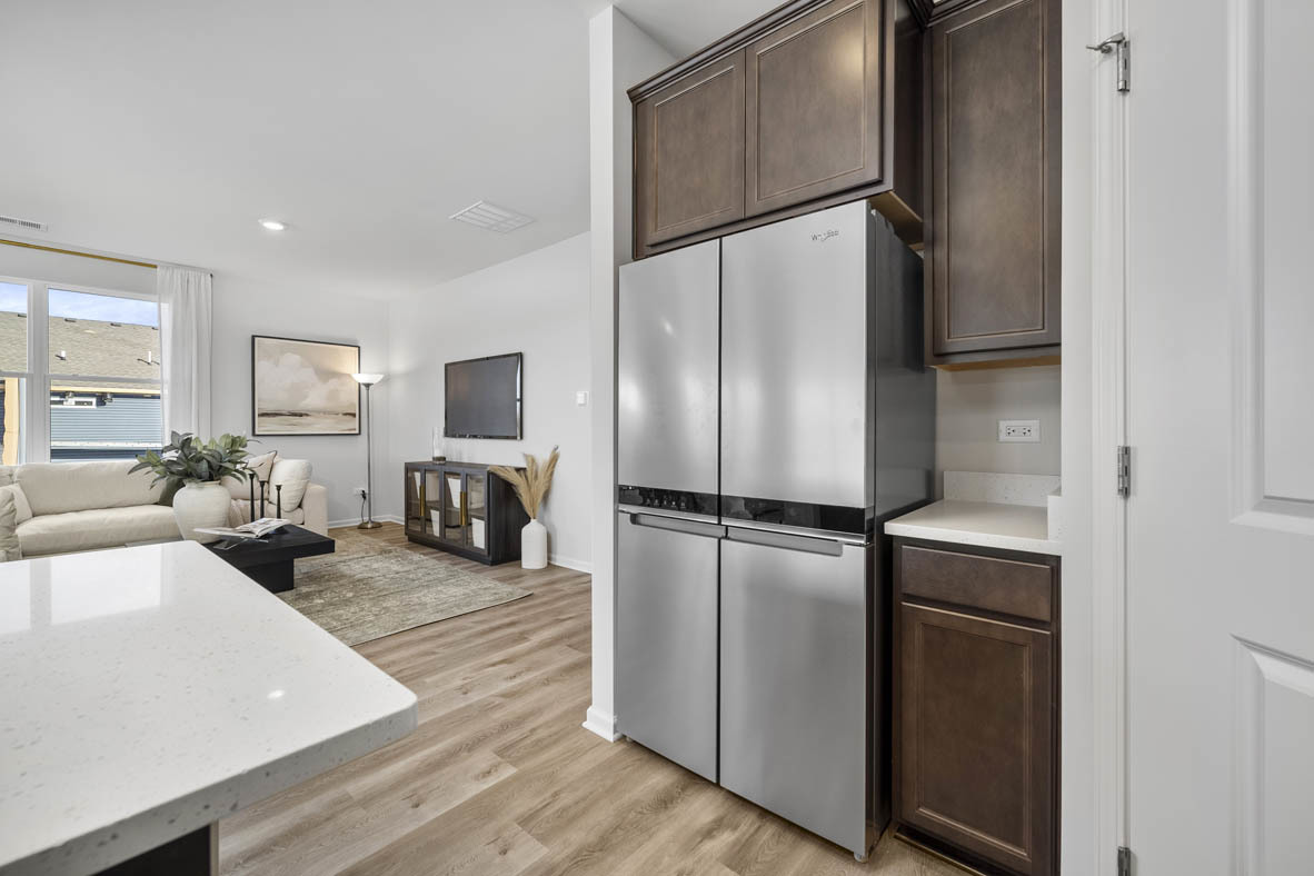 1390 Wild Tulip Circle Bartlett, IL 60103 - Photo 14 of 21 a kitchen with a refrigerator and a sink