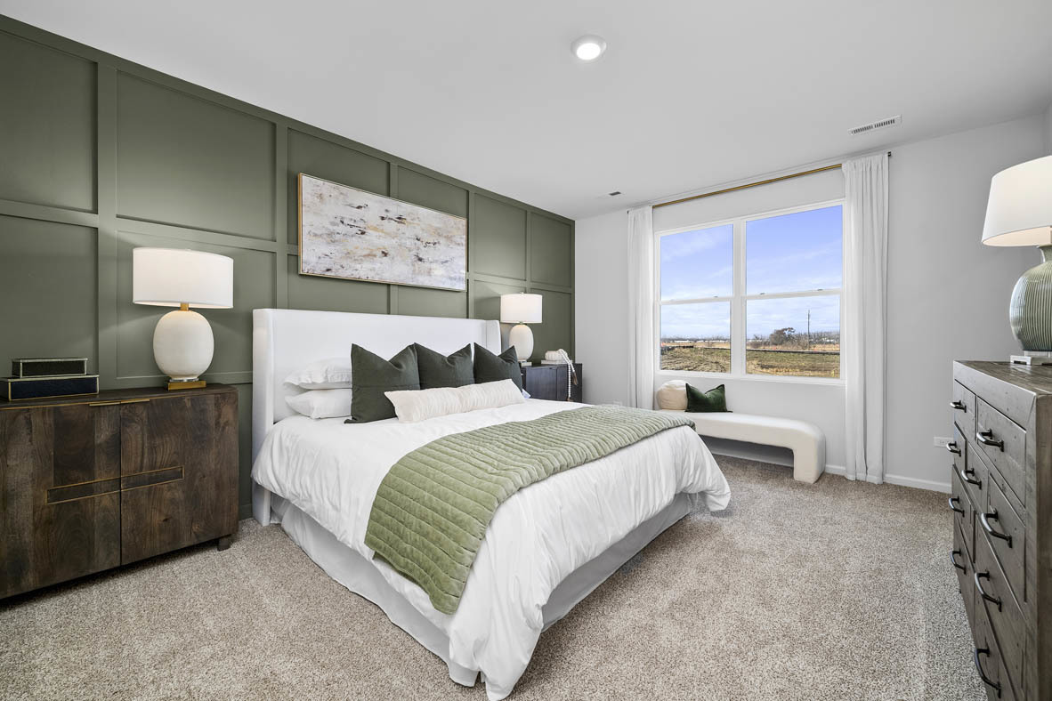 1390 Wild Tulip Circle Bartlett, IL 60103 - Photo 17 of 21 a bedroom with a bed and window