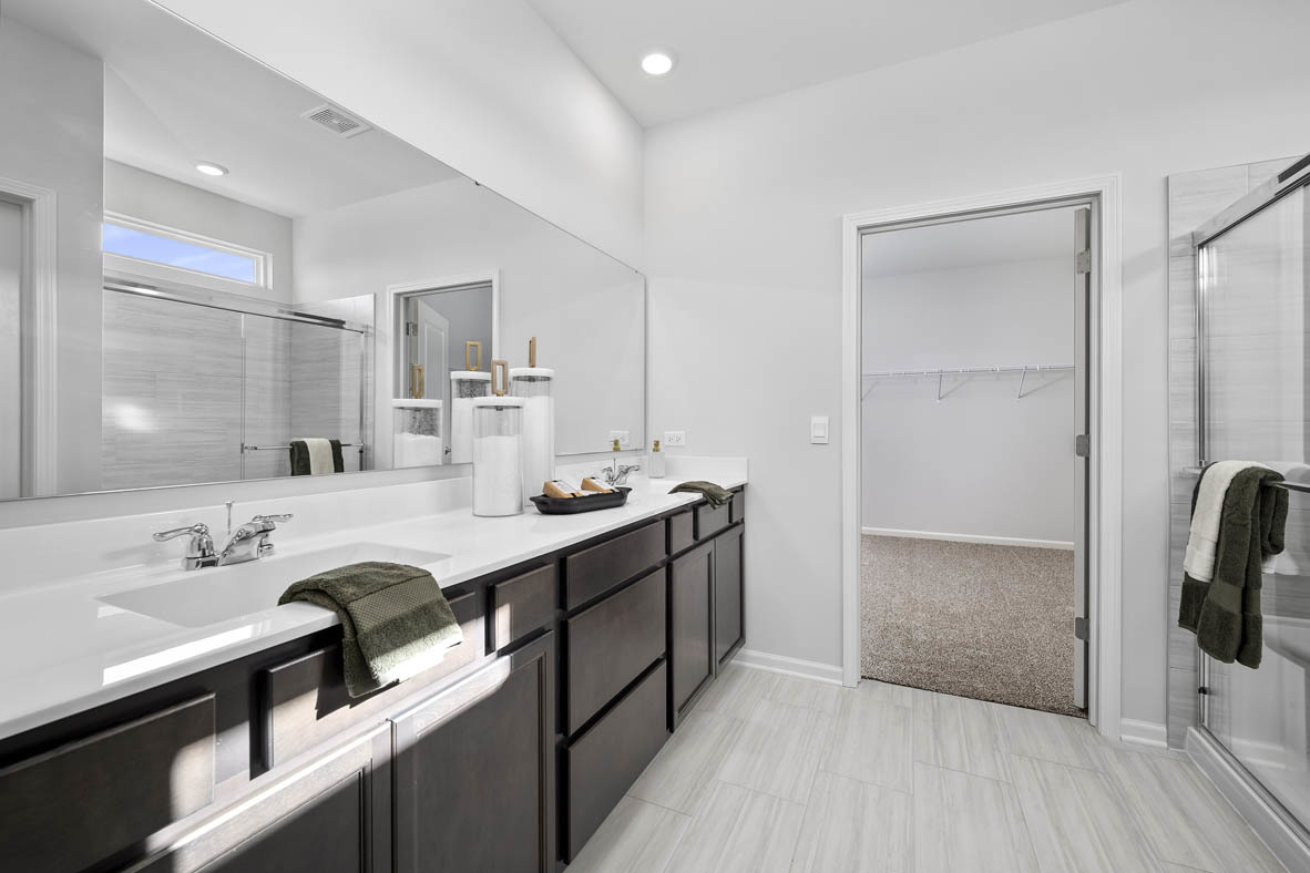 1390 Wild Tulip Circle Bartlett, IL 60103 - Photo 19 of 21 a bathroom with a sink double vanity and a mirror