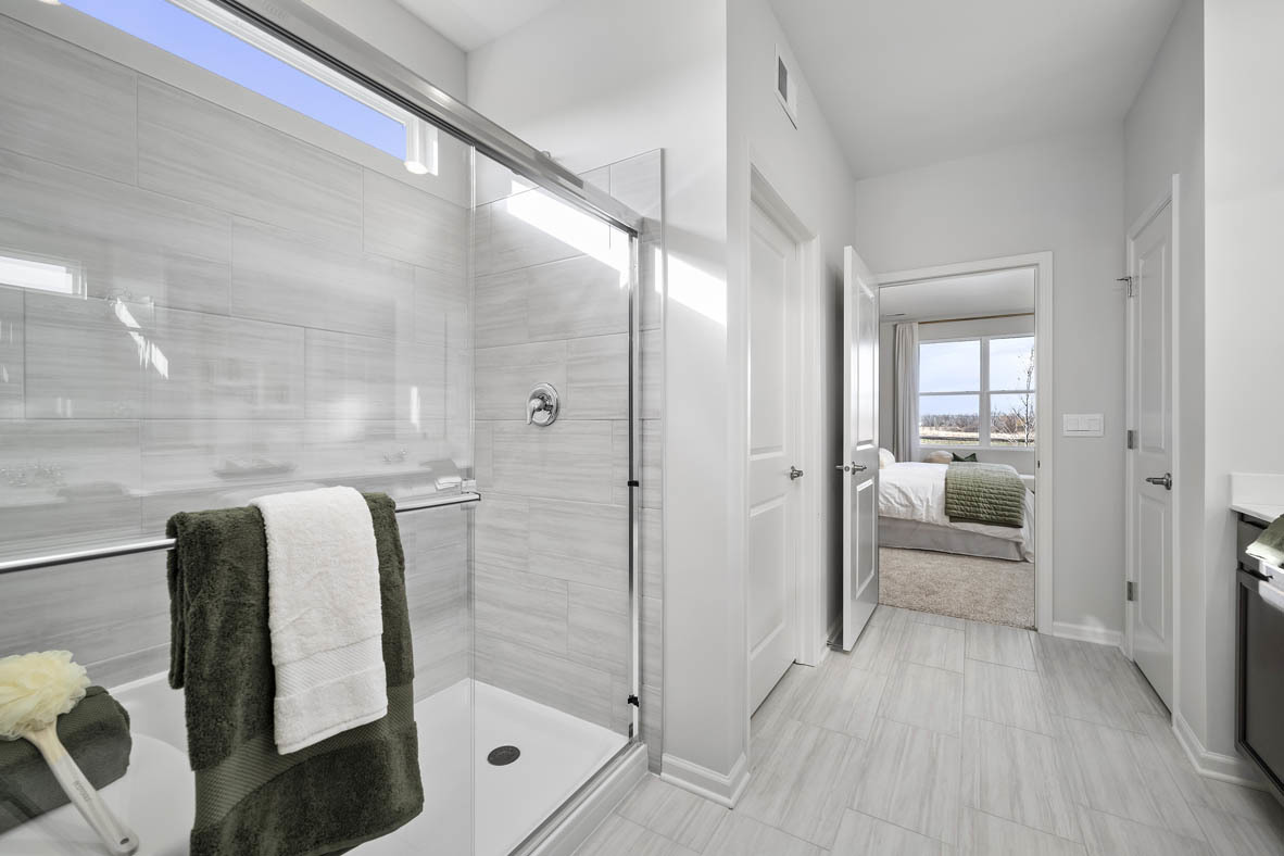 1390 Wild Tulip Circle Bartlett, IL 60103 - Photo 20 of 21 a bathroom with a tub and shower