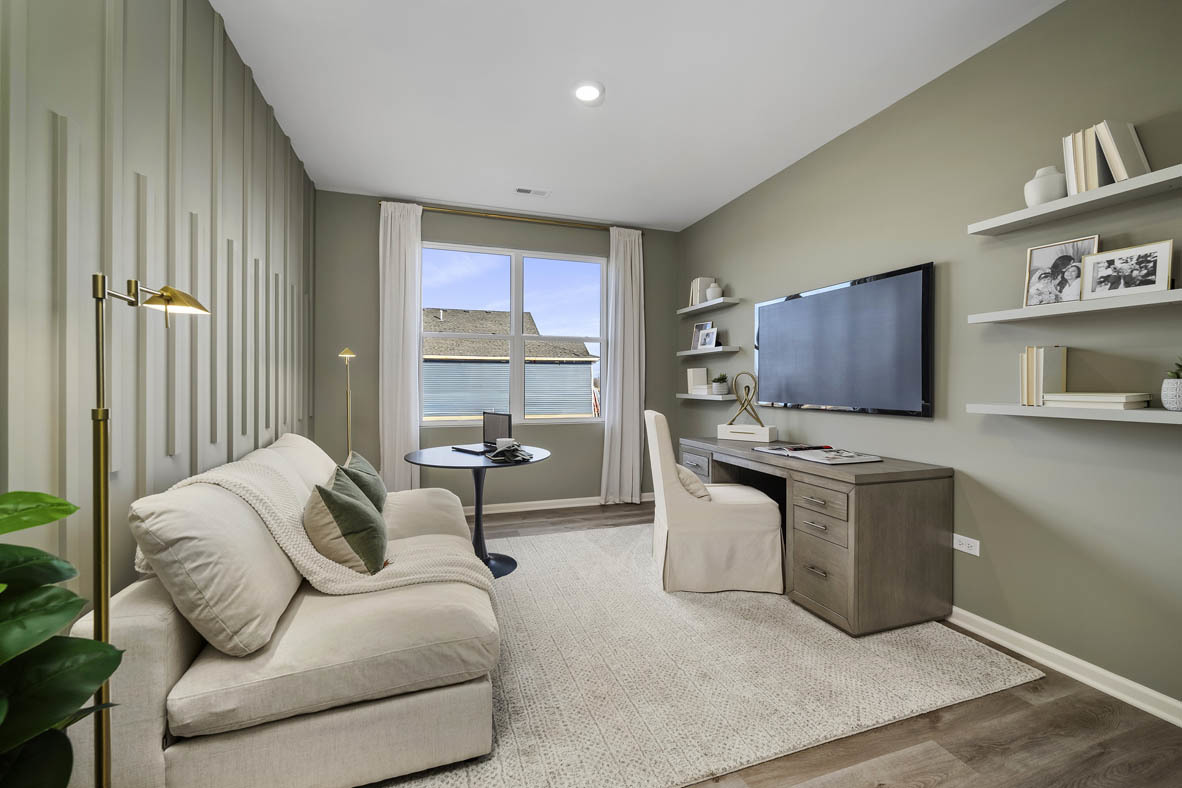 1390 Wild Tulip Circle Bartlett, IL 60103 - Photo 5 of 21 a living room with furniture and a flat screen tv