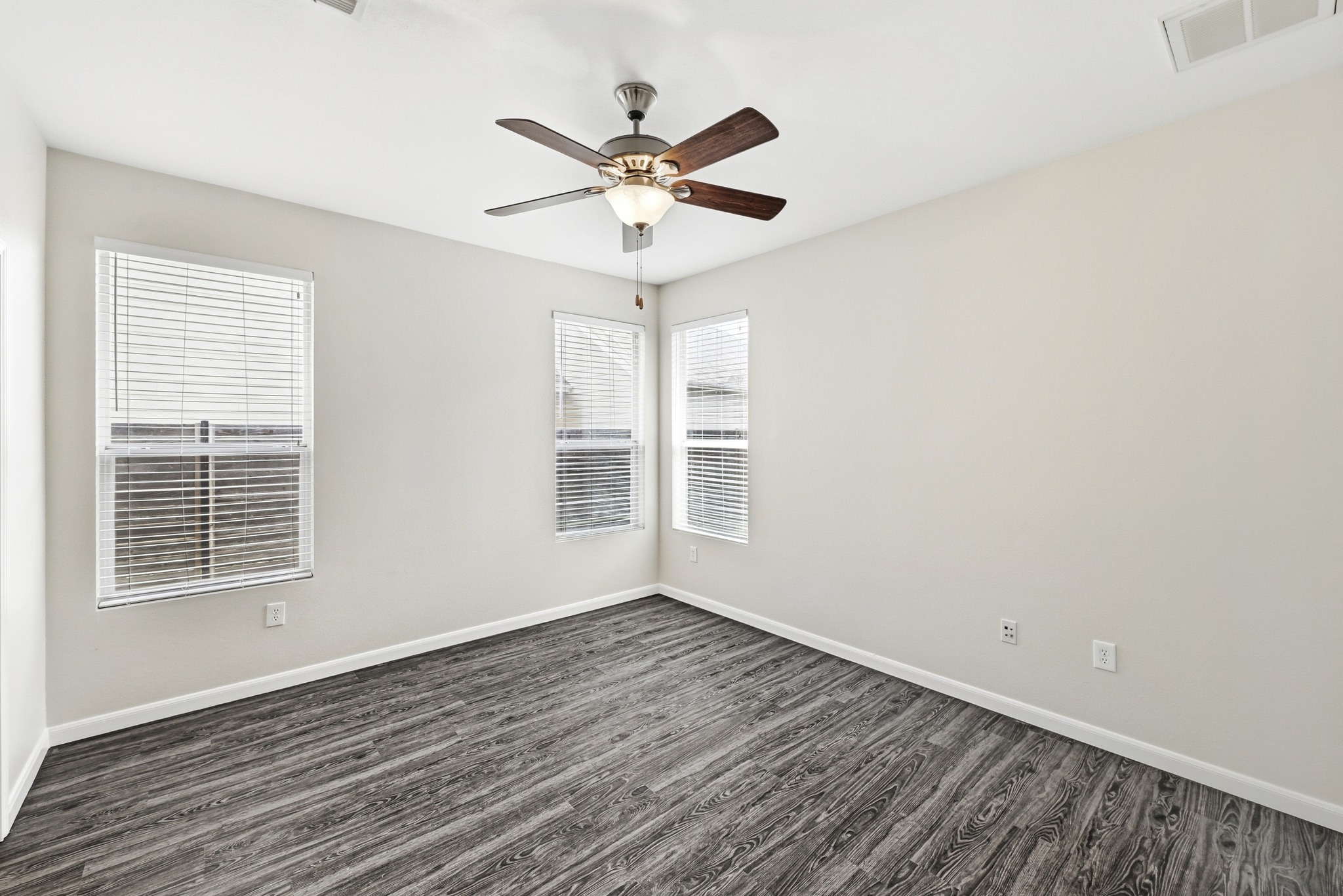 2133 Emma Long Street Austin, TX 78723 - Photo 12 of 39 The spacious primary bedroom offers a peaceful retreat at the end of the day.