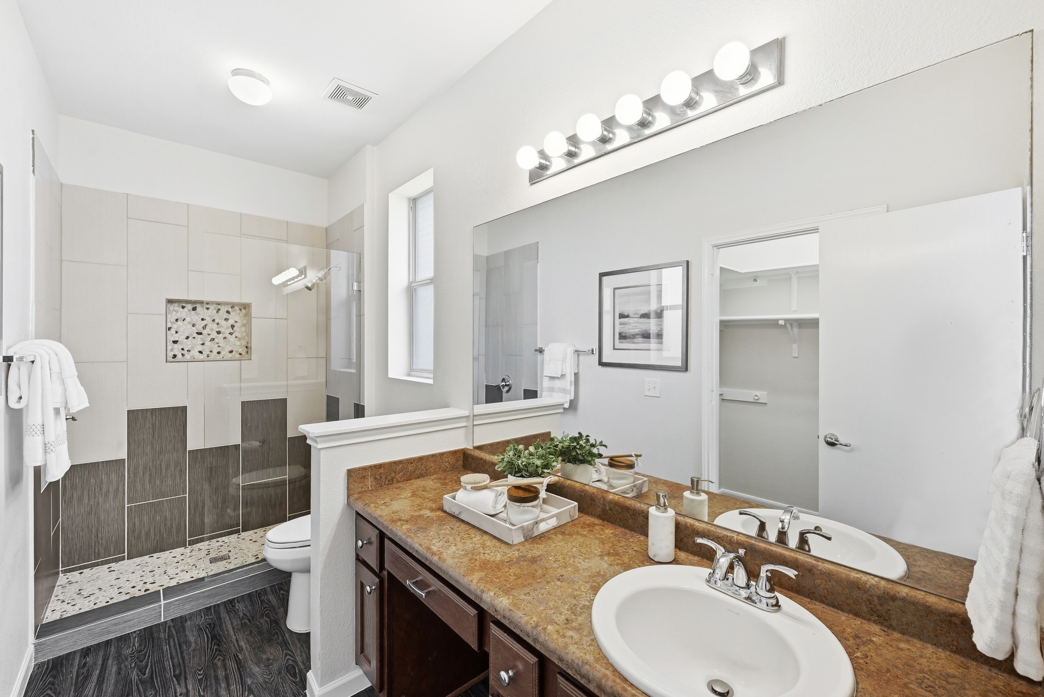 2133 Emma Long Street Austin, TX 78723 - Photo 15 of 39 The private en-suite bathroom features a walk-in shower and functional layout.