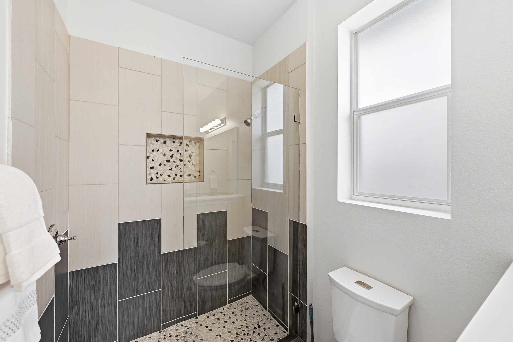 2133 Emma Long Street Austin, TX 78723 - Photo 16 of 39 Clean finishes create a bright and comfortable primary bathroom.