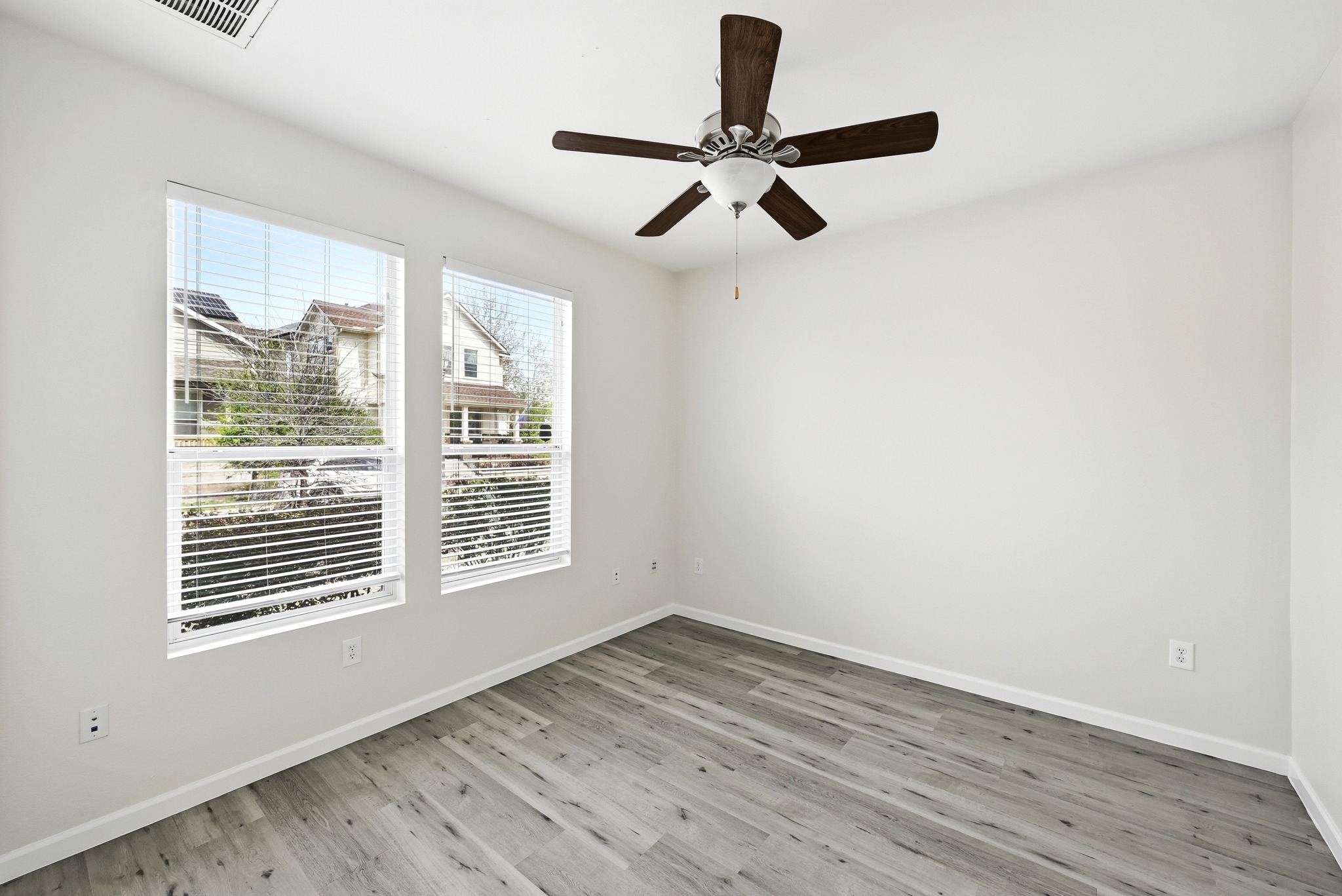 2133 Emma Long Street Austin, TX 78723 - Photo 18 of 39 The secondary bedroom offers flexibility for guests, a home office, or creative space.
