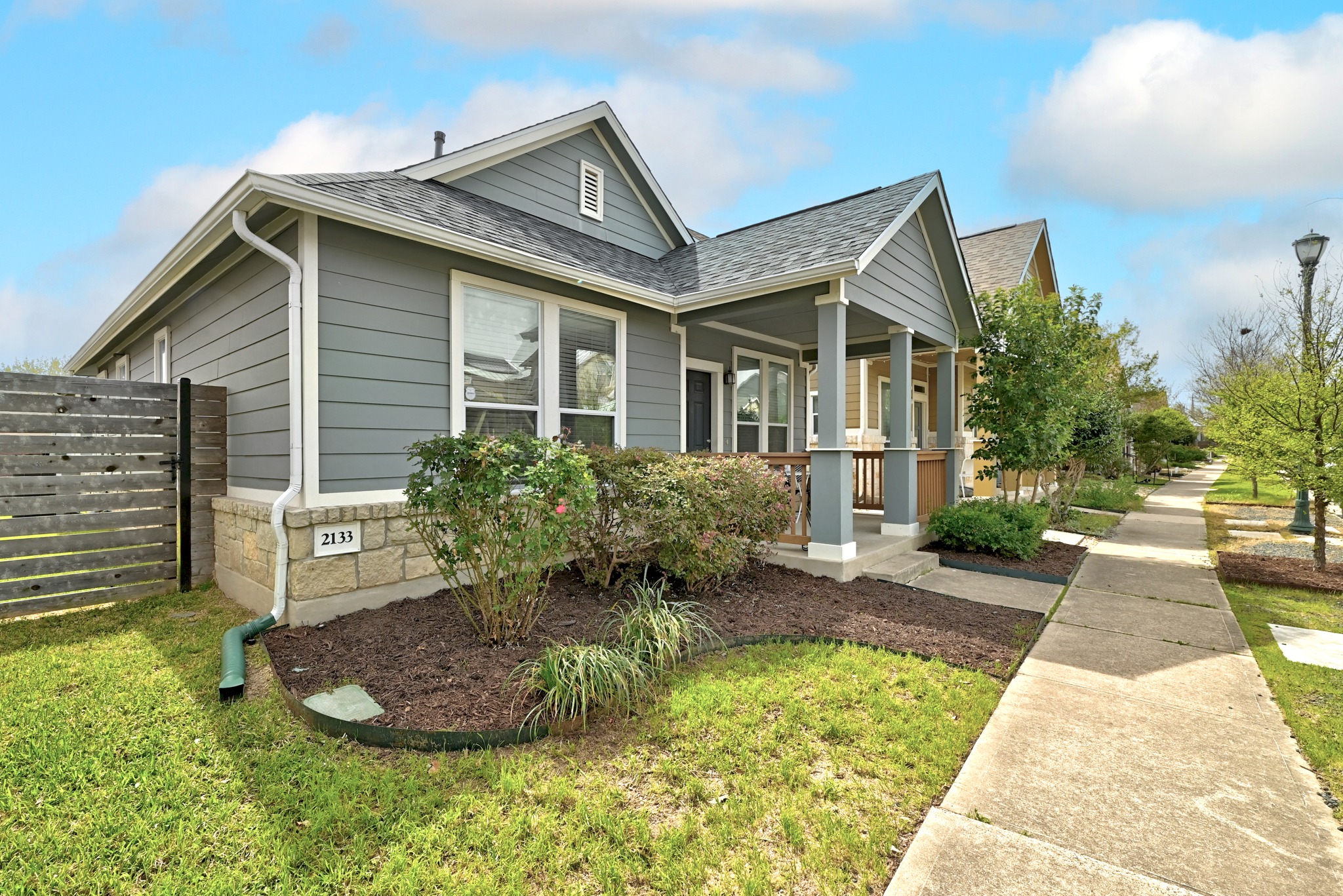2133 Emma Long Street Austin, TX 78723 - Photo 2 of 39 Charming cottage-style exterior with a welcoming covered front porch and inviting curb appeal.