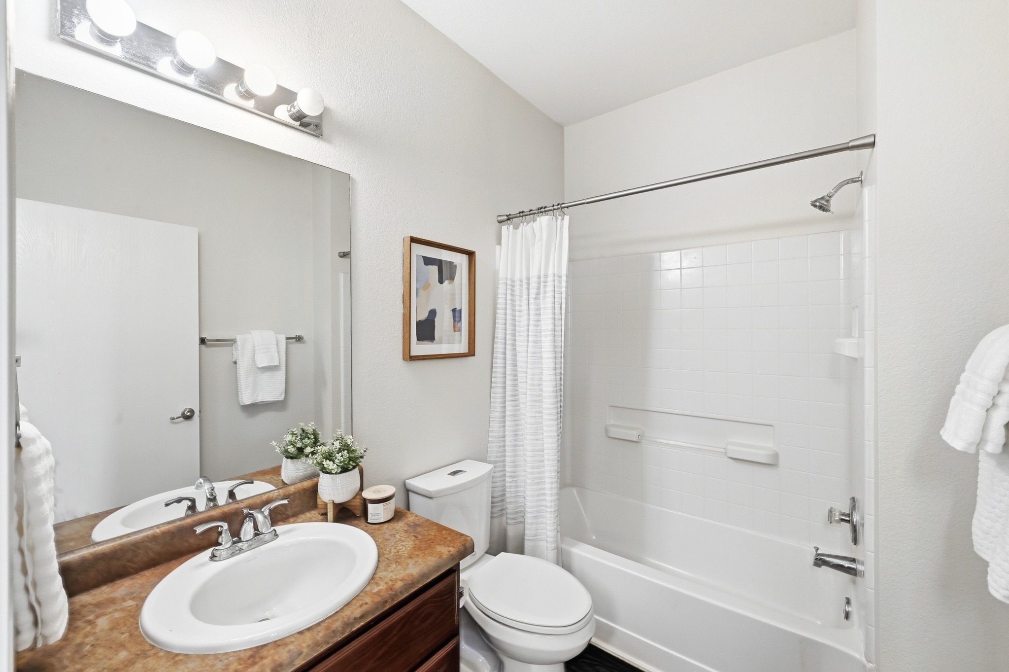 2133 Emma Long Street Austin, TX 78723 - Photo 20 of 39 Bright and functional bathroom designed for everyday use.