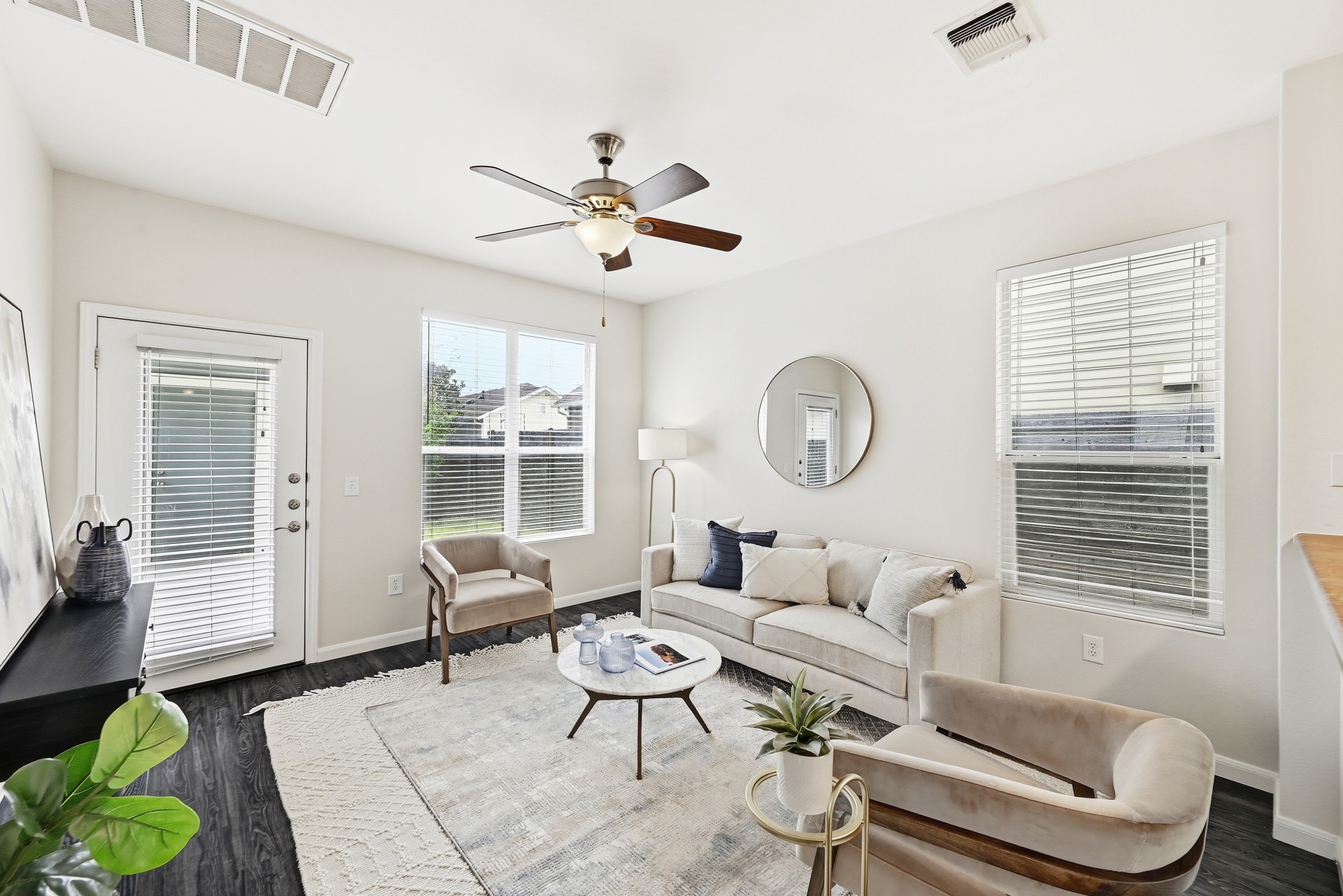 2133 Emma Long Street Austin, TX 78723 - Photo 5 of 39 The living room opens directly to the large back patio, creating effortless indoor-outdoor living; a rarity for Mueller.