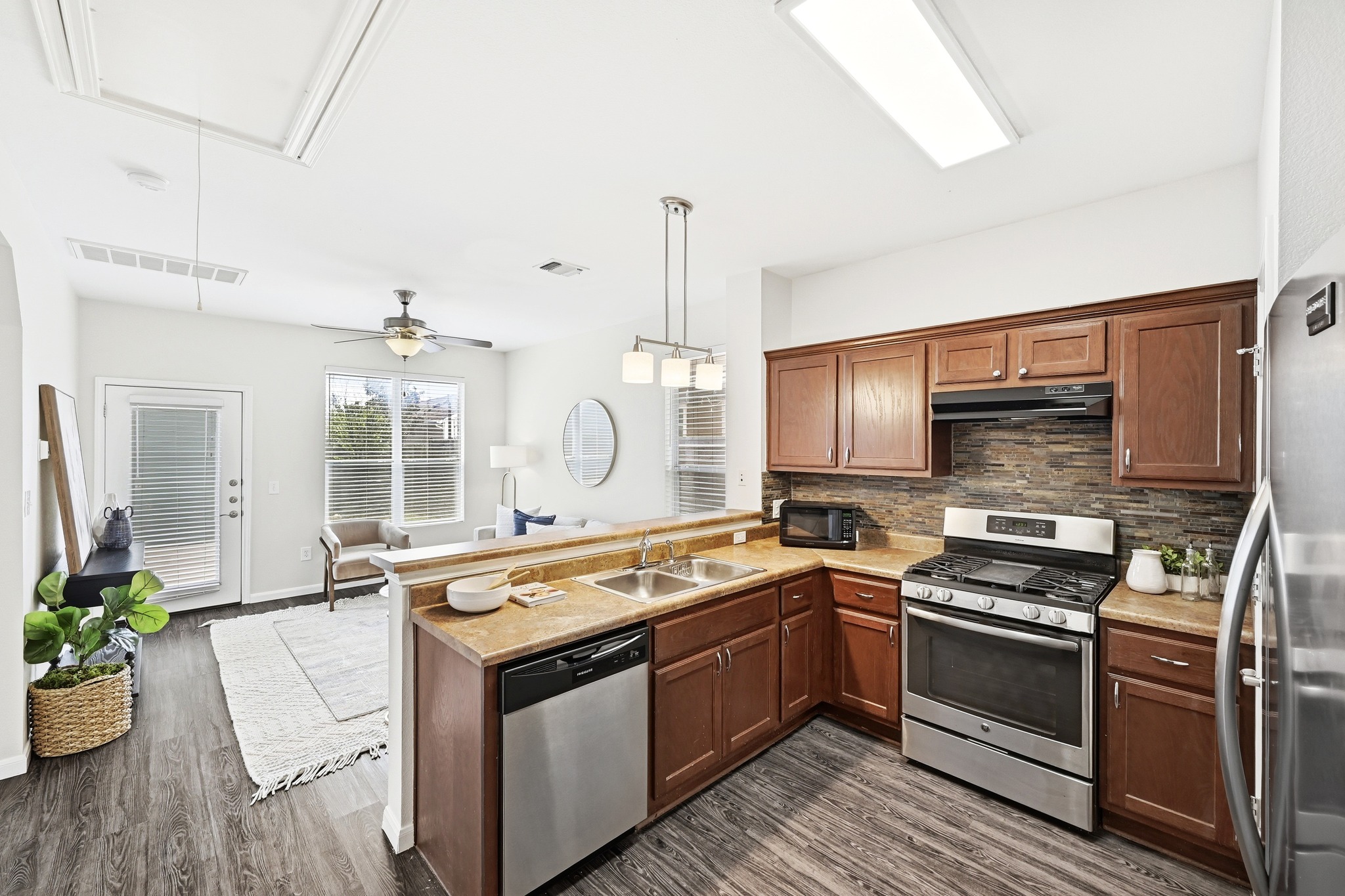 2133 Emma Long Street Austin, TX 78723 - Photo 8 of 39 The kitchen opens to the living room, making entertaining effortless.