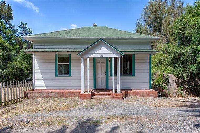 4663 Petaluma Hill Road Santa Rosa, CA 95404 - Photo 1 of 1 a front view of a house with a yard