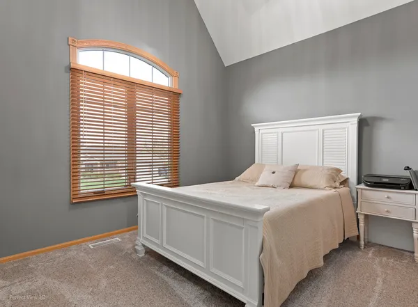 a room with a bed and a window