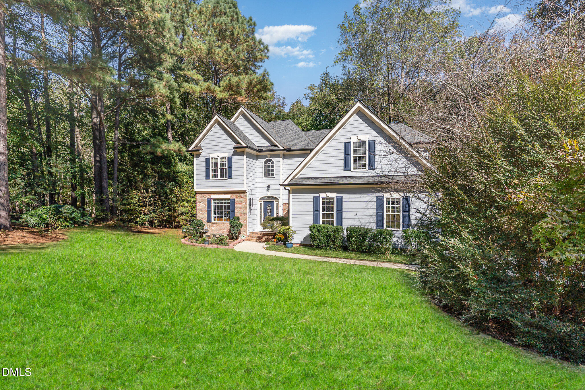 4613 Cherrybark Lane Raleigh, NC 27616 - Photo 25 of 27 a front view of a house with a yard table and chairs