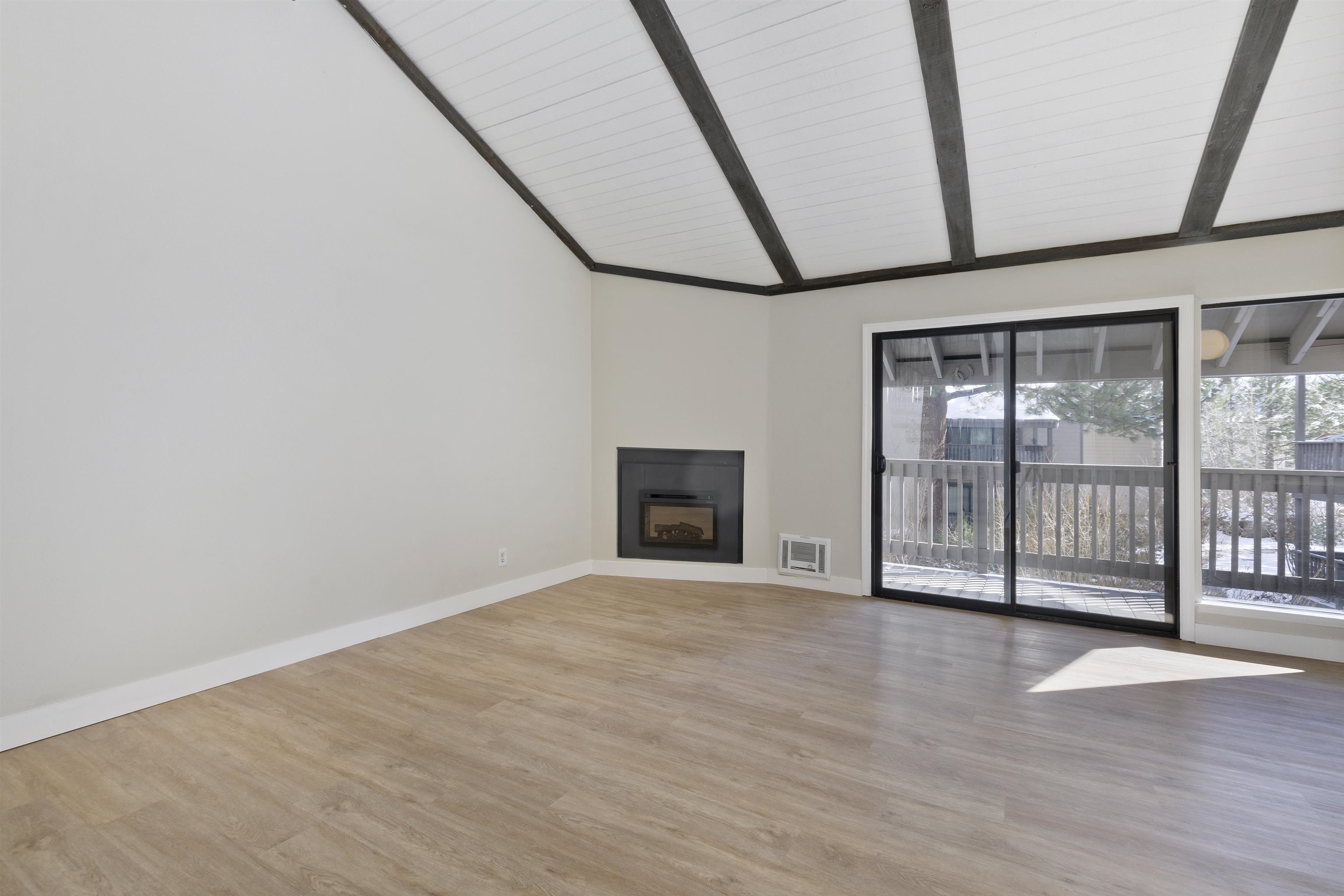 362 Old Mammoth Road, Unit 58 Mammoth Lakes, CA 93546 - Photo 3 of 26 a view of an empty room with wooden floor and a window