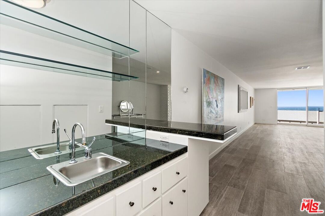 4 Jib Street, Unit 2 Marina del Rey, CA 90292 - Photo 13 of 37 a view of a kitchen with a sink and living room