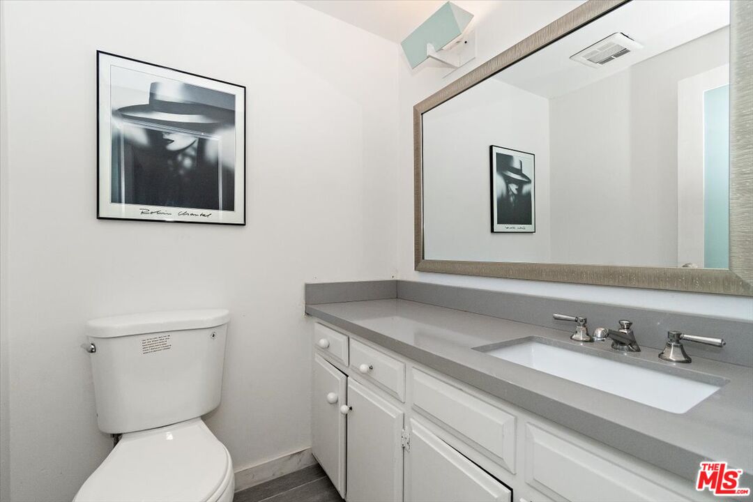 4 Jib Street, Unit 2 Marina del Rey, CA 90292 - Photo 18 of 37 a bathroom with a toilet a sink and mirror