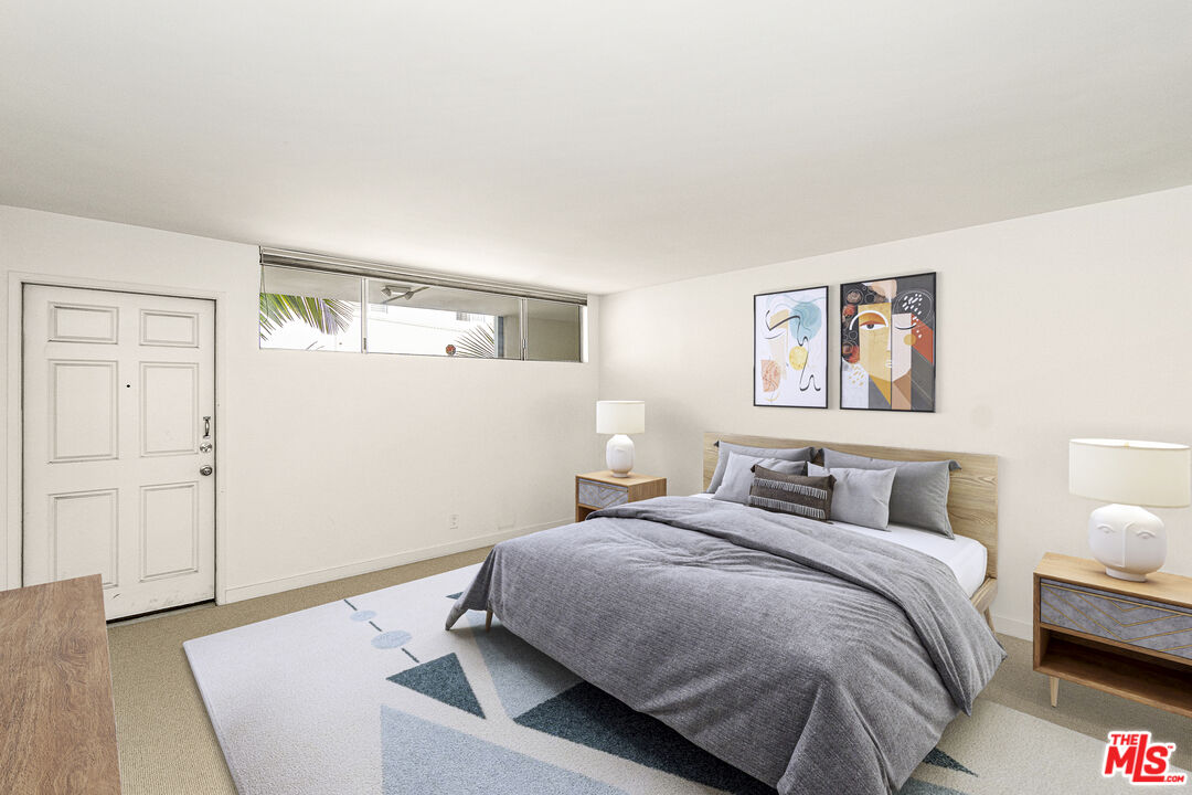 4 Jib Street, Unit 2 Marina del Rey, CA 90292 - Photo 30 of 37 a bedroom with a bed and wooden floor