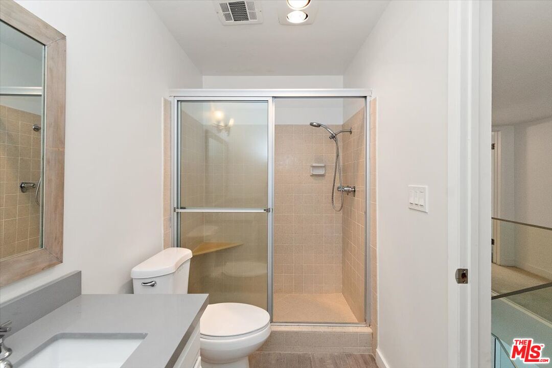 4 Jib Street, Unit 2 Marina del Rey, CA 90292 - Photo 33 of 37 a bathroom with a toilet a sink and shower