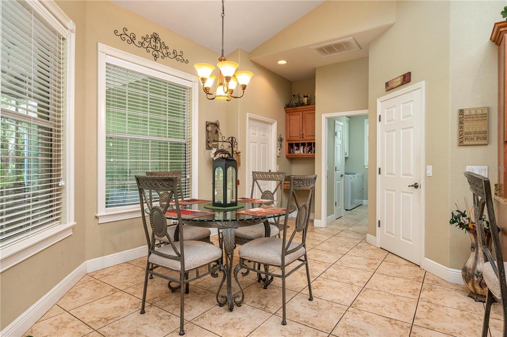 35 Stembridge Road Lake Wales, FL 33898 - Photo 17 of 61 a view of a dining room with furniture and a chandelier