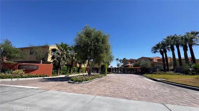 a view of street with palm trees