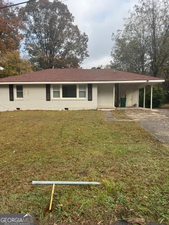 a front view of a house with yard