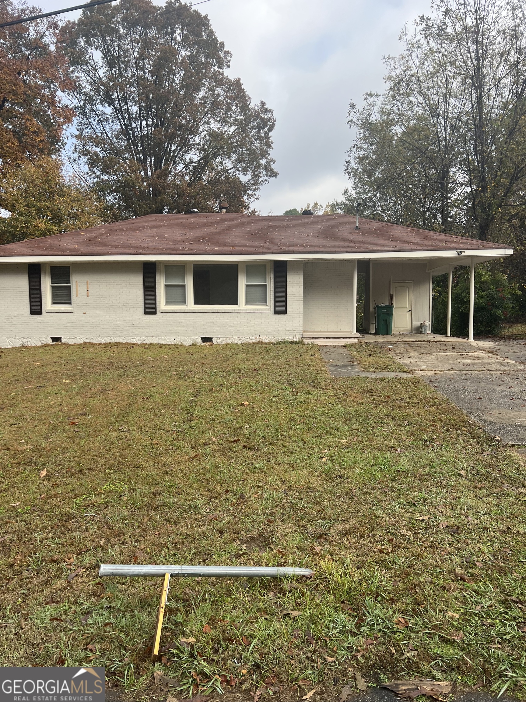 784 Spring Valley Drive Forest Park, GA 30297 - Photo 1 of 12 a front view of a house with yard