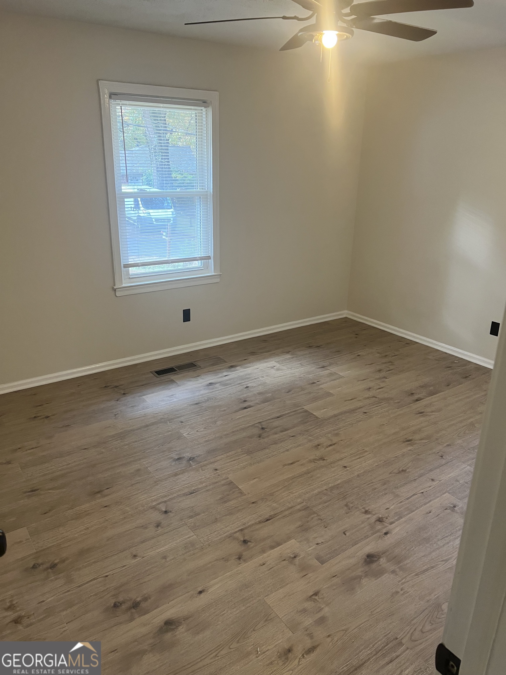 784 Spring Valley Drive Forest Park, GA 30297 - Photo 5 of 12 wooden floor in an empty room