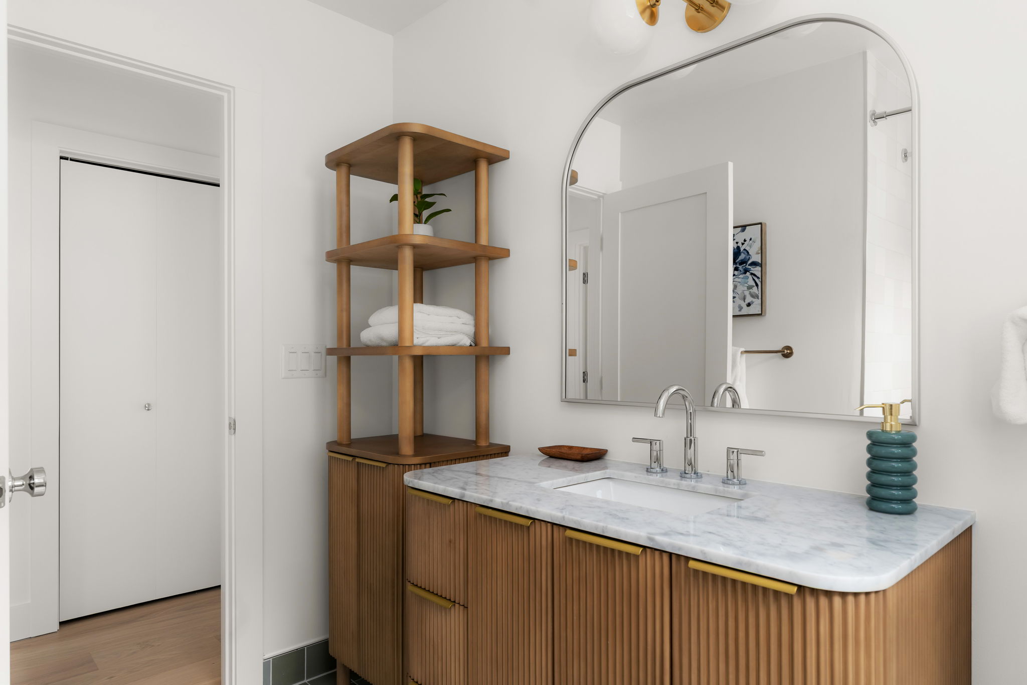 4902 Blueberry Trail, Unit 1 Austin, TX 78723 - Photo 25 of 30 a bathroom with a sink and a mirror