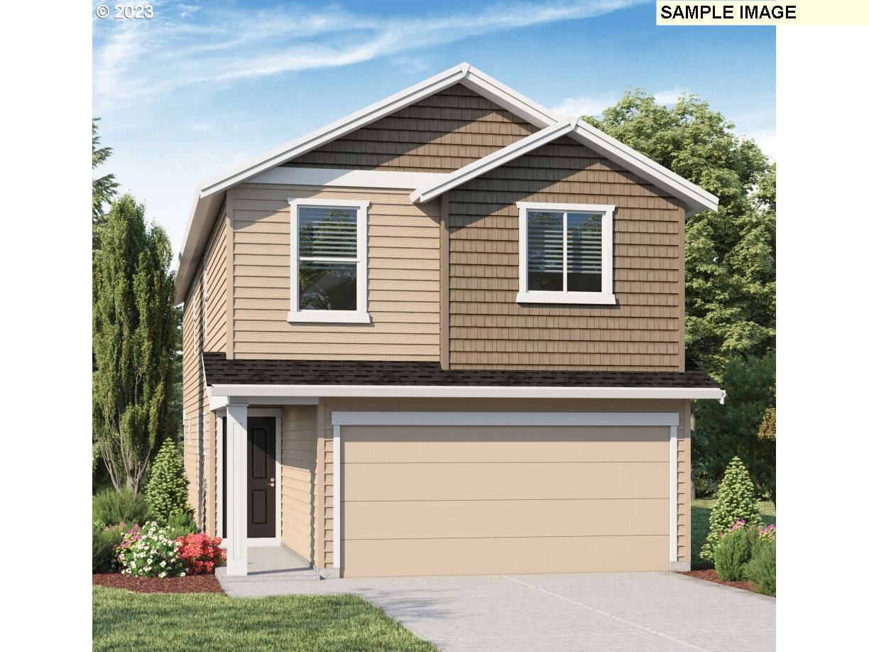 228 North 30th Drive Ridgefield, WA 98642 - Photo 1 of 24 a front view of a house with garden