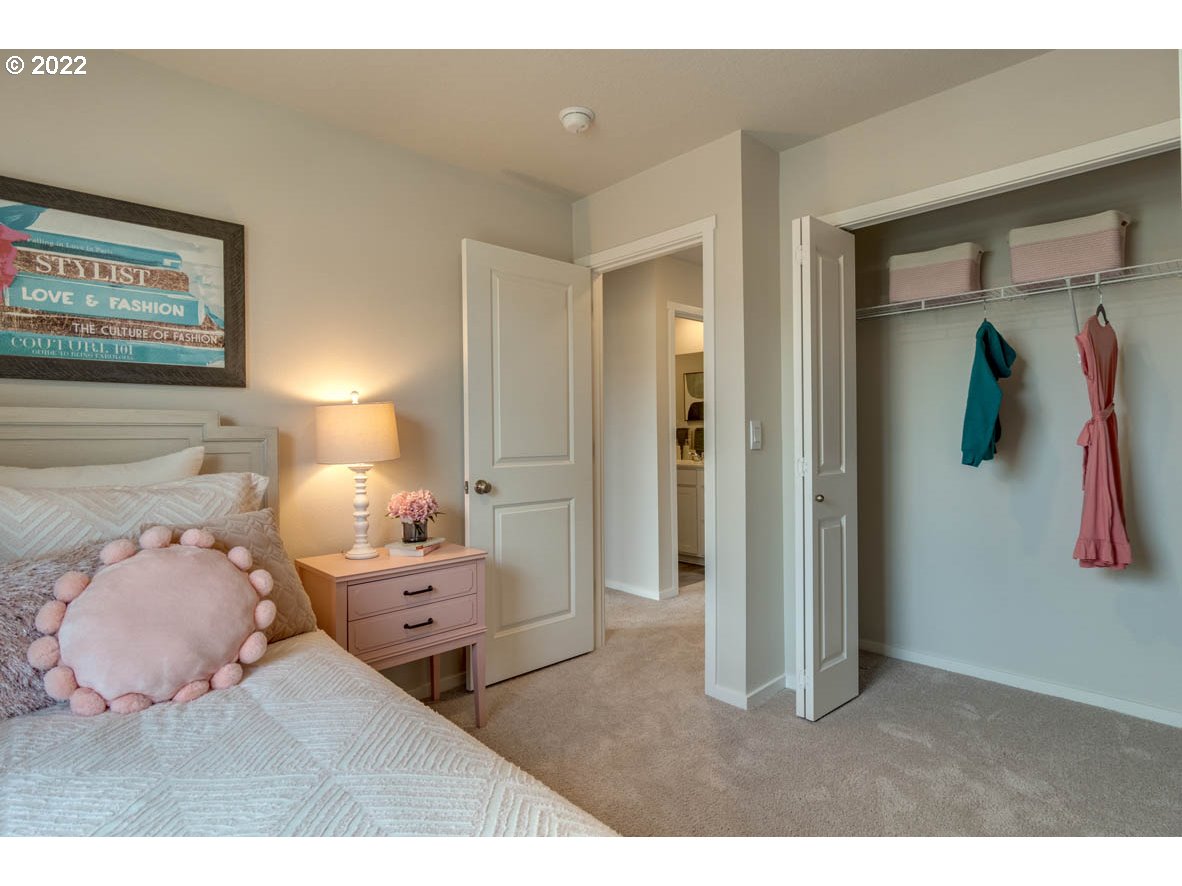 228 North 30th Drive Ridgefield, WA 98642 - Photo 13 of 24 a bedroom with a bed and painting on the wall