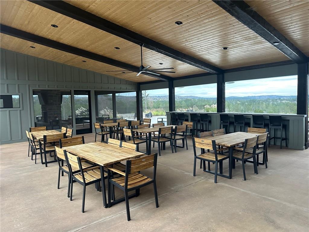 Lot 04 Blalock Mountain Road Talking Rock, GA 30175 - Photo 8 of 18 a outdoor space with lots of tables a large window and furniture